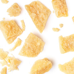 Pattern of  parmesan cheese pieces isolated on white background. Collection.  Parmesan top view. Flat lay.