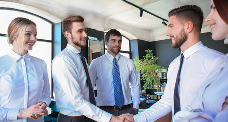 Business people shaking hands, finishing up a meeting.