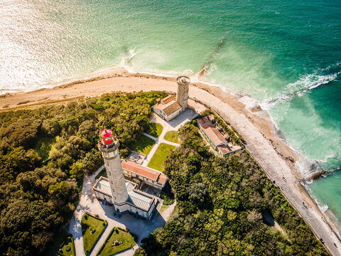 Aerial drone shot of the Phare des Baleines or Lighthouse of the Whales at sunset and sea view on Ile de Ré or island of Re France
