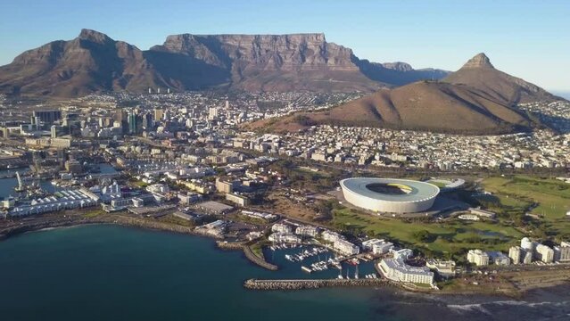  Aerial view over Cape Town, with Cape Town stadium and Table Mountain .