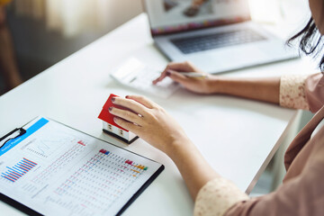 Entrepreneurs, business owners, accountants, real estate agents, focusing on table top home models with women using home equity budget calculators to assess their financial risks.