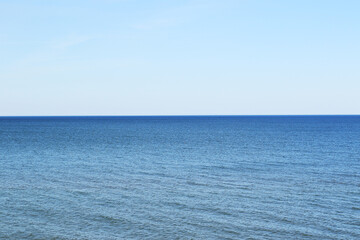 calm sea, blue water and blue sky