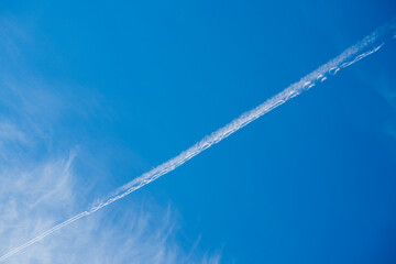 vapor trail on the blue sky