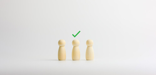 Human resource concept. The wooden figure with the green check on the head. HR management and recruitment business.