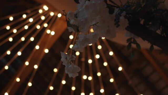 Flower under the artificial light, classy and stylish wedding place interior.