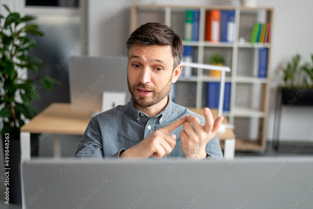 Poster virtual meeting concept. portrait of mature business manager having talk using computer at workplace