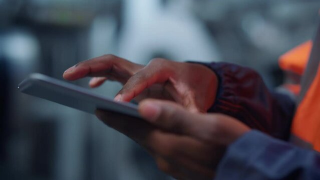 Engineer hands use tablet computer at modern manufacturing factory close up