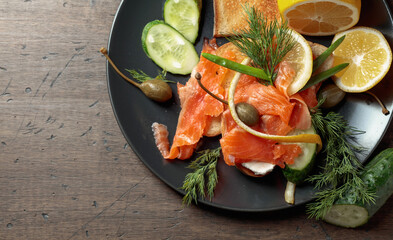 Sandwich with salmon and greens.