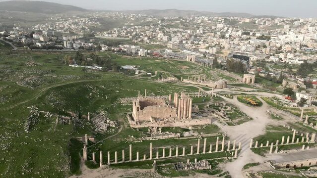 Aerial view over Temple of Artem with modern Gerasa city in the background, Jordan