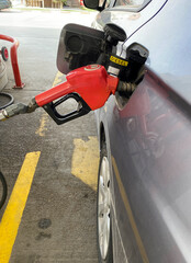 Petrol pump filling closeup, diesel price going up,Expensive gasoline .