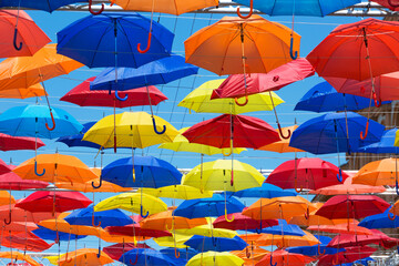 Fototapeta na wymiar Street decorated with colored umbrellas. Agueda, Portugal