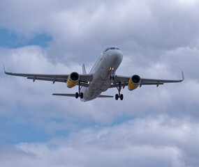 Holiday passenger jet plane landing at Manchester international airport