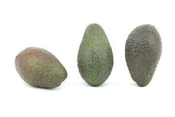 A group of avocado (Persea americana) whole isolated on white background. Oranic ripe fresh tropical fruit set on an upside down vertical and horizontal collection