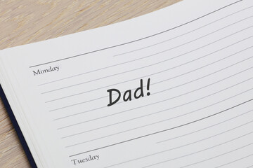 Dad reminder note in a diary page