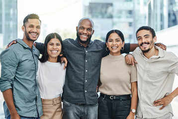 Im so happy I work with these people. Shot of a team of colleagues together in their office.