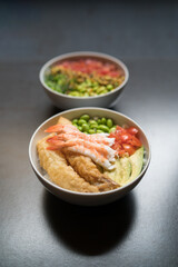 raw shrimp poke, edamame, tomato and rice in bowl, Japanese cuisine