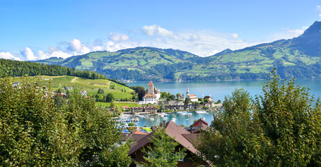 Fototapeta na wymiar idyllic harbor old town Spiez, lake Thunersee, Bernese Oberland landscape Switzerland