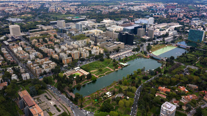 Aerial view of the modern EUR district in Rome, built for the Universal Exposition that should have been held in the Capital in 1942. In the foreground the small lake and the neighborhood park