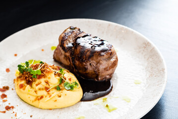 steak with mashed puree and sauce
