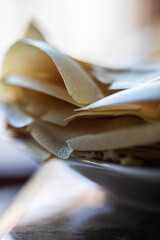 Thin crepes served on a plate. Close up.