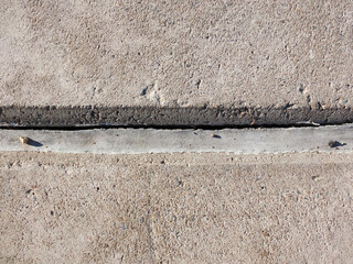 Concrete unit. Concrete  Expansion  Joints. Polyurethane putty sealant. Cracks from poor quality...