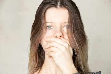 Girl with a closed mouth, forbid speaking, propaganda and silence, you can't speak the obvious in Russia