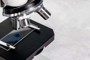 Lens of microscope close up. Research in scientific medical laboratory