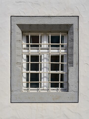 Fototapeta premium single window with window grille in the old town of Wittenberg in Germany