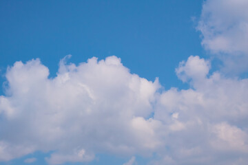 light and airy blue sky with closeup clouds. peace and heaven beautiful backgrounds	