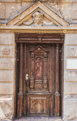 Antique wooden brown door with gable