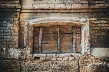 Old boarded up window. Elements of old houses