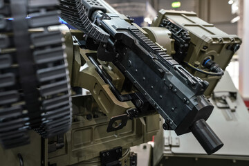 Heavy military machine gun cannon displayed on defence fair - closeup detail