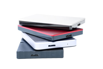 Four portable external hard disk drives stacked
