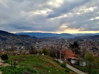 Fototapeta premium Panorama of Sarajevo, mountain Trebevic, Igman, Bjelasnica and Bitovnja seen from Zmajevac viewpoint, Bosnia and Herzegovina
