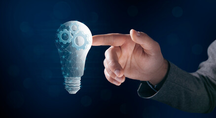 gears in a light bulb from the network. concept mechanism of ideas. Man clicks on the screen