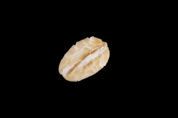 natural oat seed isolated on black background