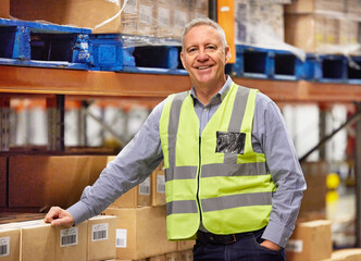 The man in charge of warehouse operations. Portrait of a mature man working in a warehouse.