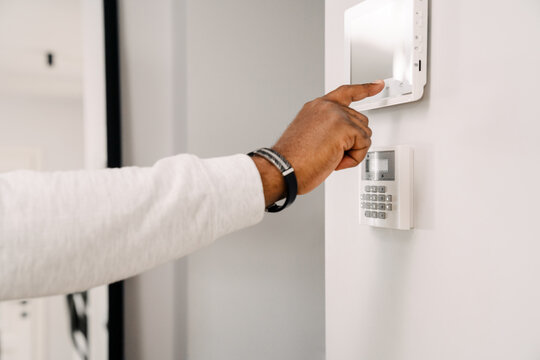 Black Man's Hand Opening Door With Security Code