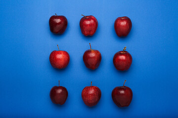 fresh apples on blue background .Top view