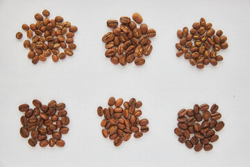 different types of coffee are piled in heaps