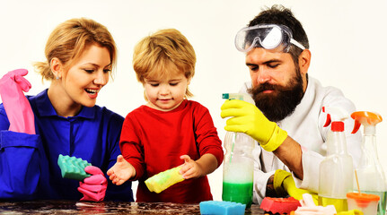 Cleaning time. Family clean together. Mother and father teach little son cleans in house.