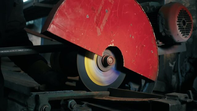 close-up, cutting of metal structures, making homemade armor plate by professional worker using a cutting machine. cutting work with smooth equipment for steel metal, iron, sparks in a heavy industry 