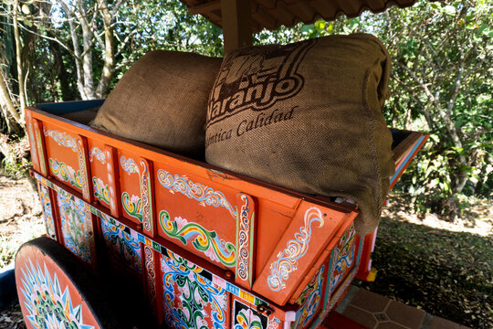Sarch&iacute;, Costa Rica: Brilliantly painted oxcart (Las carreta) with burlap sacks of coffee beans from Naranjo canton. Coffee beans grown in Costa Rica were traditionally transported by ox carts. 