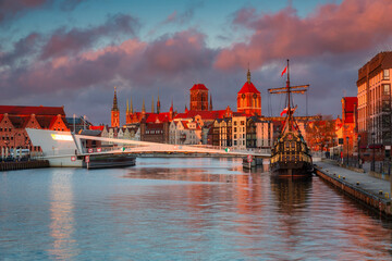 Beautiful architecture of Gdansk old town reflected in the Motlawa river at sunrise, Poland