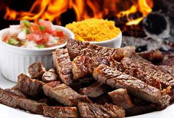 Grilled picanha with rice, farofa and salad