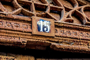 Vintage plate on the house with the number 15