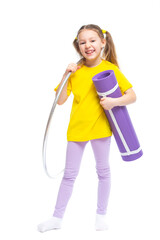Little cute girl with hula hoop and gym mat. Isolated on white background.