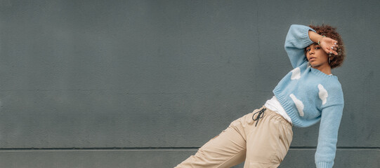 young african american girl posing on the street