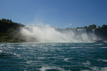 Niagara Falls from Canada side during the summer with ships. 