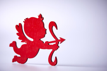red Cupid shooting  on the white background